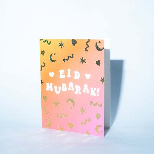 Eid Mubarak card with colorful design on a light blue background